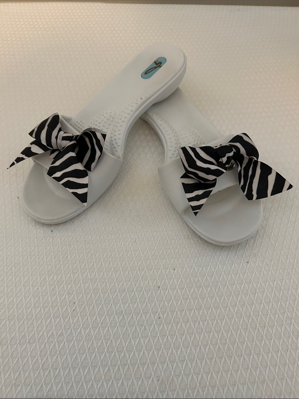 OKA b. White Slide Sandals with Black Zebra Bow Size M/L